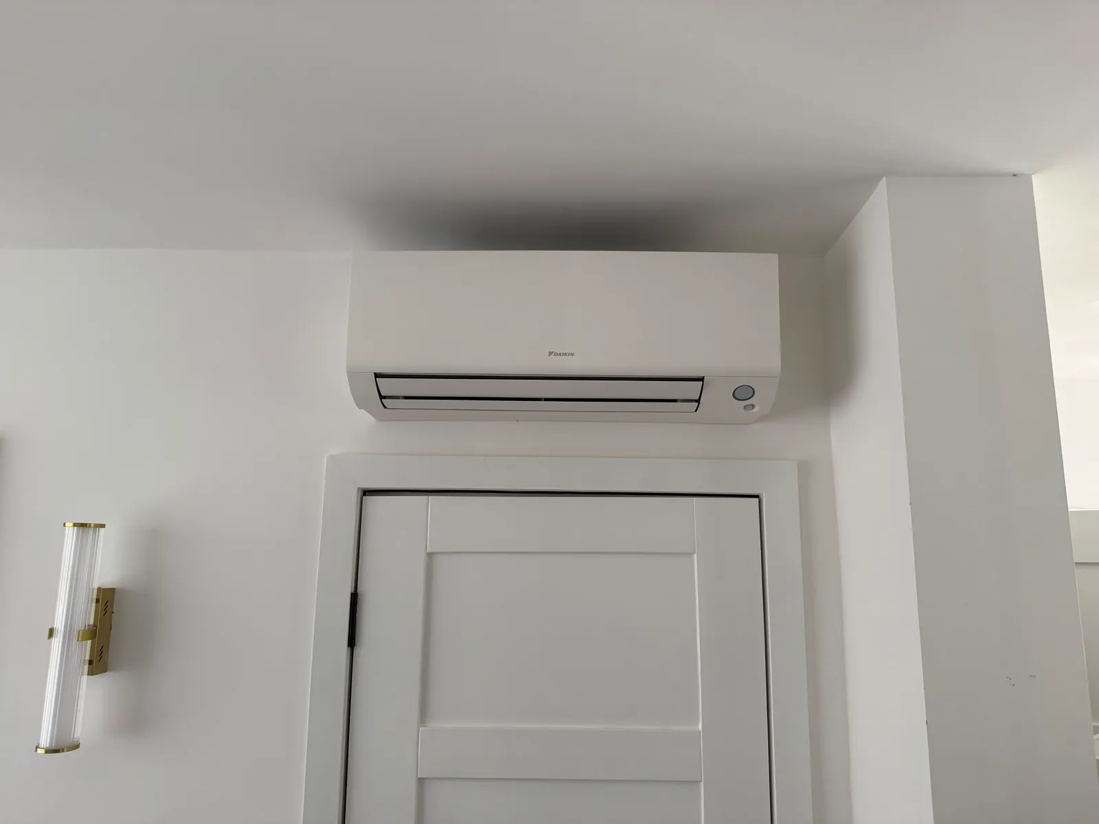 Daikin wall-mounted AC unit in a Teddington bedroom