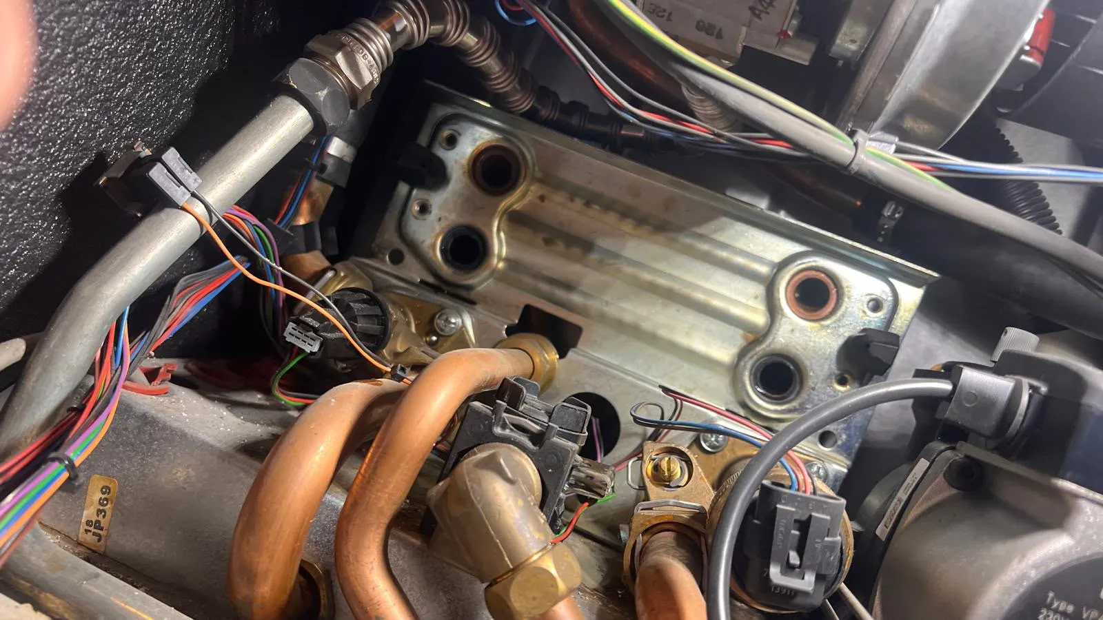 Gas boiler internals exposed during a service